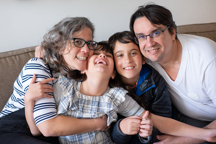 A family embracing and smiling together
